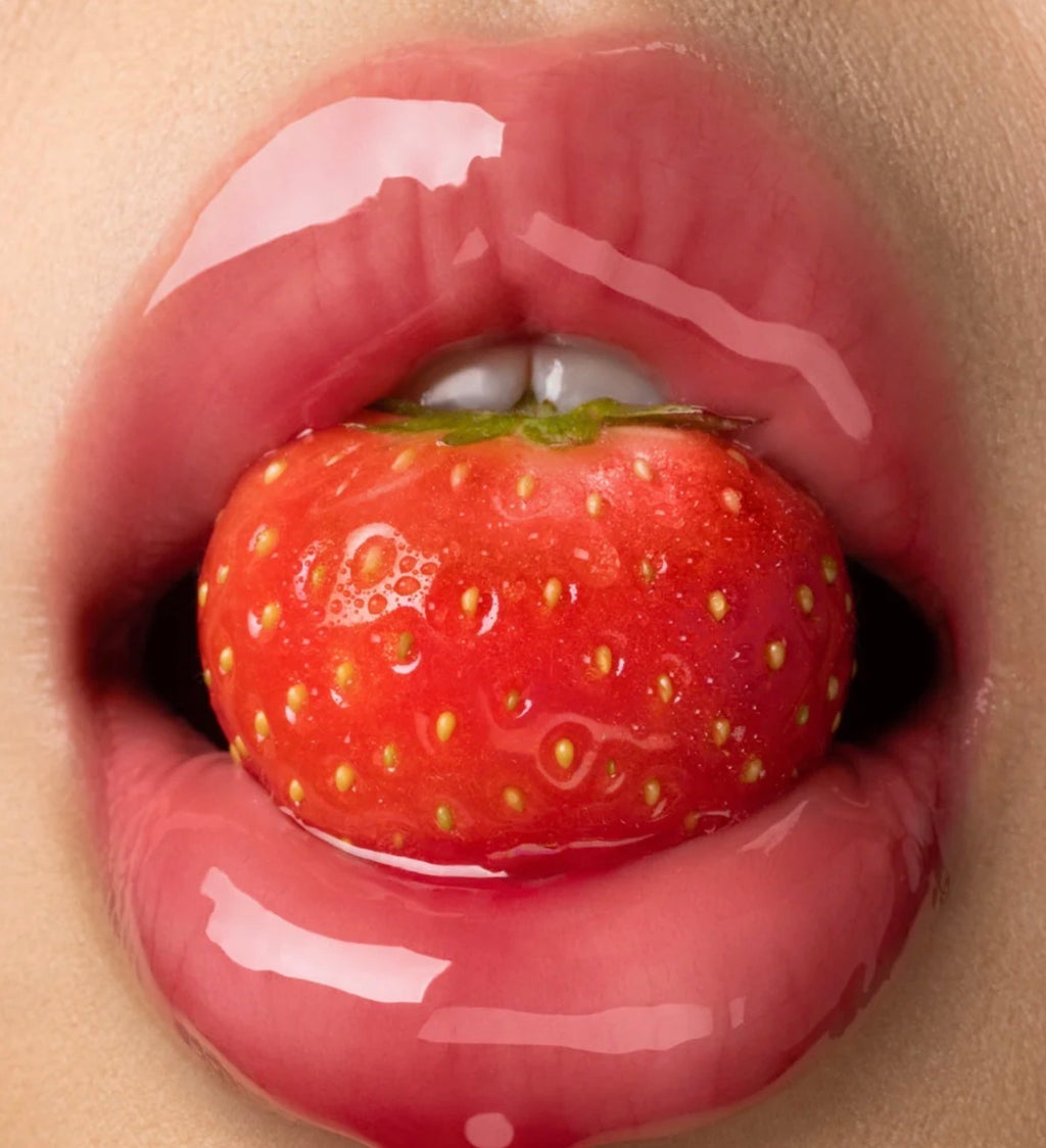 GISOU - A sheer, red lip oil with pink undertones and a fruity strawberry scent.