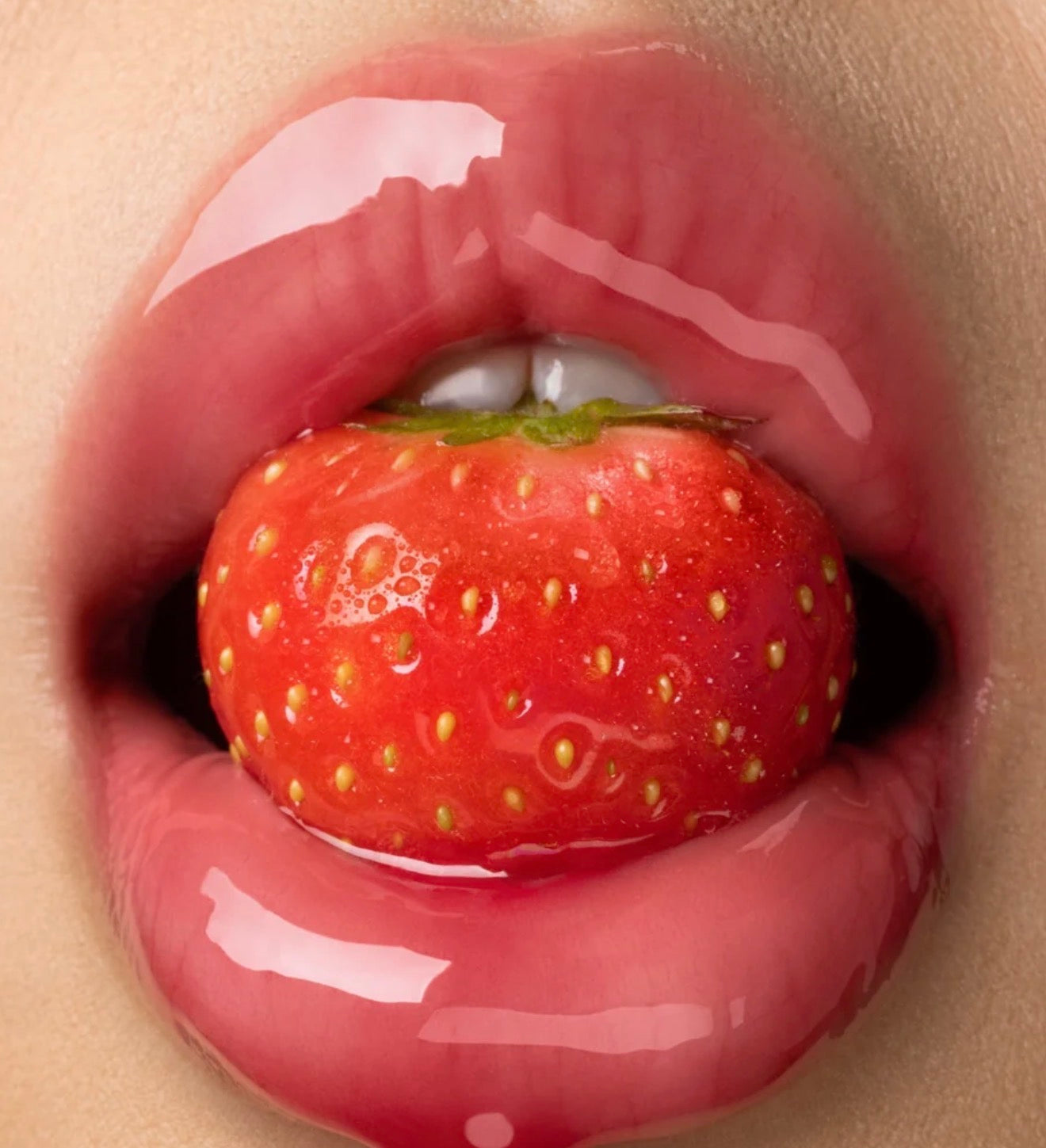 GISOU - A sheer, red lip oil with pink undertones and a fruity strawberry scent.