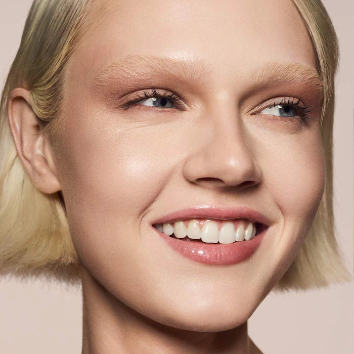 Fenty Beauty by Rihanna 
Gloss Bomb Universal Lip Gloss Luminizer Color: FU$$Y - shimmering pink